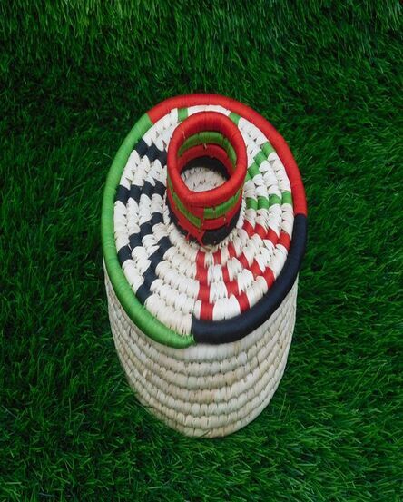 Handcrafted Sabai Grass Basket with Red, Green and White Design