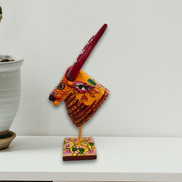 Wooden Cow in Sunlit Yellow and Brick Red