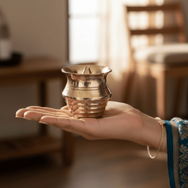 Handcrafted brass agarbatti stand with golden finish for pooja rituals.