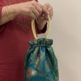 teal-peacock-feather-banarasi-potli-bag-7390111.jpg