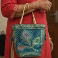teal-peacock-feather-banarasi-potli-bag-7571700.jpg
